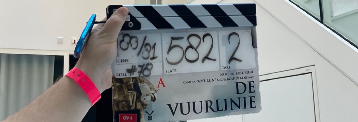 Een klapbord van film De Vuurlinie